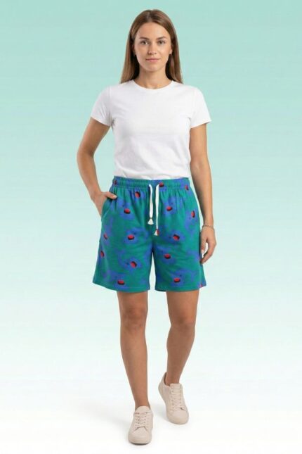 Fun teal-colored shorts with open-mouth shark pattern and adjustable drawstring waistband.