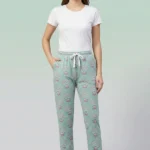 Full-body image of a model wearing elegant teal mandala print women's pajamas with intricate designs, drawstring with tassels, and hands in pockets.