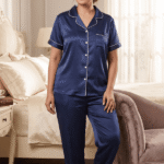 Woman in navy blue satin co-ord set with white piping premium nightwear