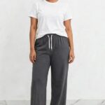 Model wearing charcoal grey relaxed fit wide leg lounge pajama pants free size up to 3XL