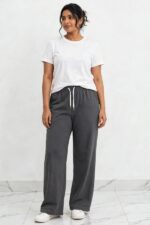 Model wearing charcoal grey relaxed fit wide leg lounge pajama pants free size up to 3XL