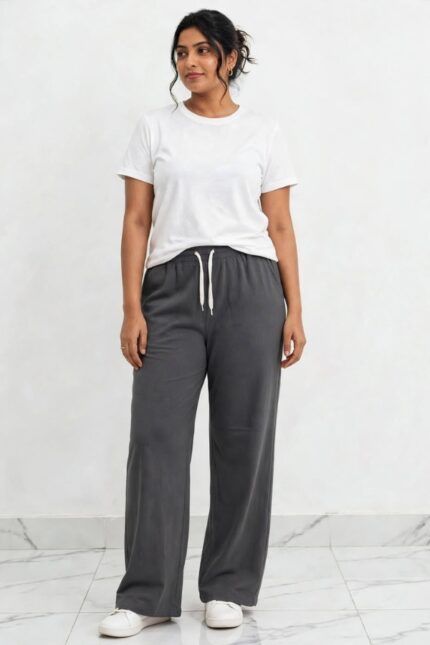 Model wearing charcoal grey relaxed fit wide leg lounge pajama pants free size up to 3XL