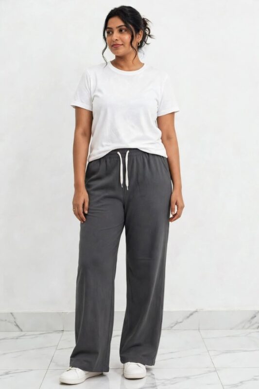 Model wearing charcoal grey relaxed fit wide leg lounge pajama pants free size up to 3XL