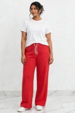 Model wearing cherry red bright red relaxed wide leg lounge pajama pants free size 3XL