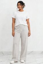 Model wearing light grey ash grey relaxed wide leg lounge pajama pants