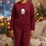 Woman wearing maroon cozy teddy fleece winter lounge set with embossed paw pattern and cute puppy print, free size upto 3XL