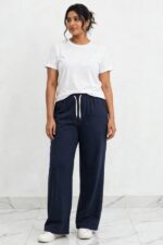 Model wearing midnight navy blue relaxed wide leg lounge pajama pants
