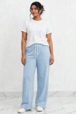 Model wearing sky blue powder blue relaxed wide leg lounge pajama pants