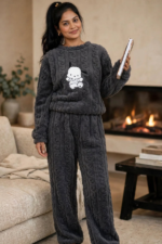 Woman wearing charcoal grey cable knit sherpa fleece winter co-ord set with cute puppy print relaxed fit free size