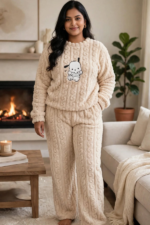 Woman wearing cream beige cable knit sherpa fleece winter loungewear set with cute puppy print relaxed fit
