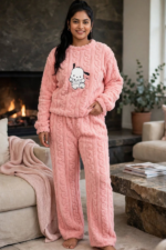 Woman wearing pastel pink fluffy cable knit winter co-ord set with cute puppy graphic relaxed fit free size upto 3xl
