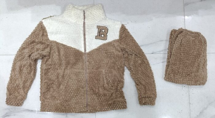 Actual brown and cream plush zip-front top with matching folded pyjamas